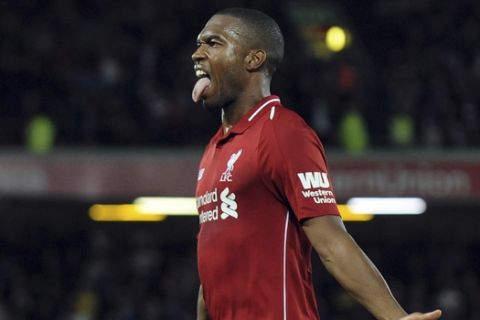 Liverpool's Daniel Sturridge celebrates after scoring his side's opening goal during the English League Cup soccer match between Liverpool and Chelsea at Anfield stadium in Liverpool, England, Wednesday, Sept. 26, 2018. (AP Photo/Rui Vieira)