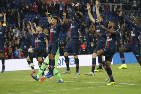 PSG players celebrate their victory during the French League One soccer match between Paris-Saint-Germain and Amiens at the Parc des Princes stadium in Paris, France, Saturday, Oct. 20, 2018. (AP Photo/Francois Mori)