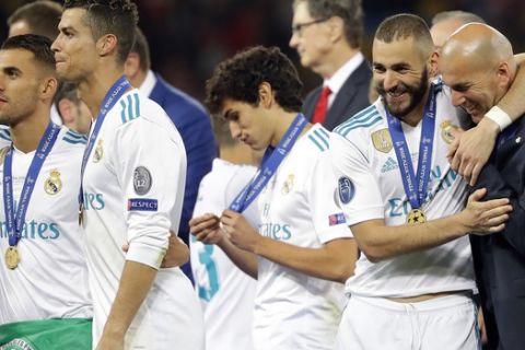 Real Madrid players celebrate after winning the Champions League Final soccer match between Real Madrid and Liverpool at the Olimpiyskiy Stadium in Kiev, Ukraine, Saturday, May 26, 2018. (AP Photo/Sergei Grits)