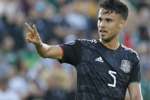 Mexico defender Diego Reyes (5) celebrates his goal during a CONCACAF Gold Cup soccer match between Mexico and Cuba in Pasadena, Calif., Saturday, June 15, 2019. Mexico won 7-0. (AP Photo/Ringo H.W. Chiu)