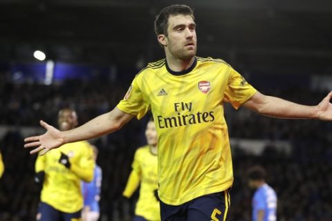Arsenal's Sokratis Papastathopoulos celebrates after scoring his side's first goal during the English FA Cup fifth round soccer match between Portsmouth and Arsenal at Fratton Park stadium in Portsmouth, England, Monday, March 2, 2020. (AP Photo/Kirsty Wigglesworth)