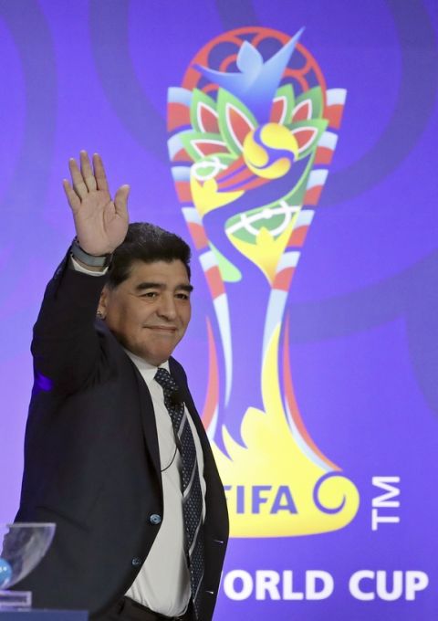 Argentina's former soccer player Diego Maradona waves upon his arrival for the official draw for the FIFA U-20 World Cup Korea 2017 in Suwon, South Korea, Wednesday, March 15, 2017. The FIFA U-20 World Cup Korea 2017 matches will be held in six South Korean cities from May 20 to June 11. (AP Photo/Lee Jin-man)