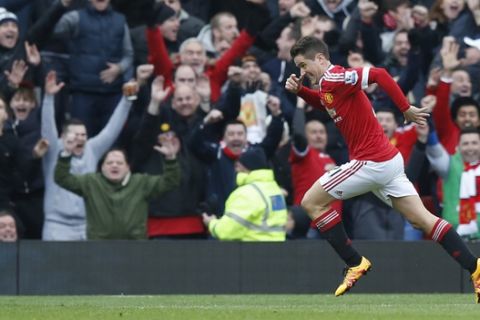 Manchester United's Ander Herrera reacts and celebrates after scoring his sides third goal of the game during the English Premier League soccer match between Manchester United and Arsenal at Old Trafford Stadium, Manchester, England, Sunday, Feb. 28, 2016. (AP Photo/Jon Super)  