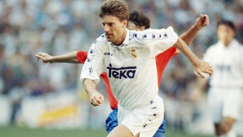 Read Madrids Danish forward Michael Laudrup is tackled by a Zaragoza player during a first division league soccer match in Madrid on Sunday, April 9, 1995. Real won the match 3-0. (AP Photo/Denis Doyle)