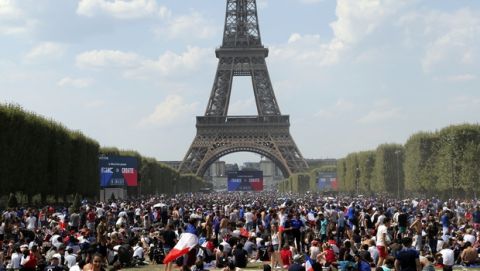 Supporters of the French soccer team gather on the Champ de Mars next to the Eiffel Tower ahead of the World Cup final between France and Croatia, Sunday, July 15, 2018 in Paris. (AP Photo/Bob Edme)