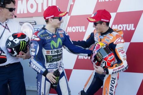 VALENCIA, SPAIN - NOVEMBER 07:  (L-R) Marc Marquez of Spain and Repsol Honda Team jokes with Jorge Lorenzo of Spain and Movistar Yamaha MotoGP  at the end of the qualifying practice during the MotoGP of Valencia - Qualifying at Ricardo Tormo Circuit on November 7, 2015 in Valencia, Spain.  (Photo by Mirco Lazzari gp/Getty Images)
