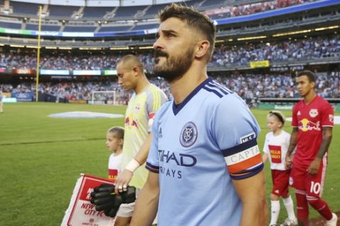 NYCFC forward David Villa, center, walks out before an MLS soccer match against the New York Red Bulls, Wednesday, Aug. 22, 2018, in New York. The match ended in a 1-1 draw. (AP Photo/Steve Luciano)