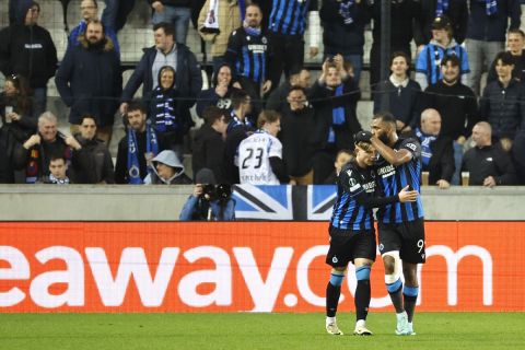 Brugge's Michal Skoras, left, is congratulated by Brugge's Ferran Jutgla after scoring his sides third goal during the Europa Conference League Round of 16, second leg, soccer match between Club Brugge and Molde at the Jan Breydel Stadium in Bruges, Belgium, Thursday, March 14, 2024. (AP Photo/Geert Vanden Wijngaert)