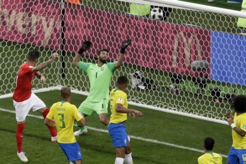 Switzerland's Steven Zuber, left, scores his side's first goal during the group E match between Brazil and Switzerland at the 2018 soccer World Cup in the Rostov Arena in Rostov-on-Don, Russia, Sunday, June 17, 2018. (AP Photo/Andrew Medichini)