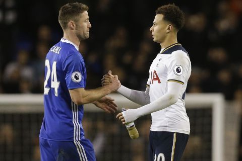 Tottenham's Dele Alli, right, shakes hands with Chelsea's Gary Cahill after the English Premier League soccer match between Tottenham Hotspur and Chelsea at White Hart Lane stadium in London, Wednesday, Jan. 4, 2017. Tottenham won 2-0. (AP Photo/Alastair Grant)