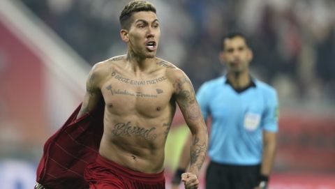Liverpool's Roberto Firmino celebrates after scoring the opening goal during the Club World Cup final soccer match between Liverpool and Flamengo at Khalifa International Stadium in Doha, Qatar, Saturday, Dec. 21, 2019. (AP Photo/Hussein Sayed)