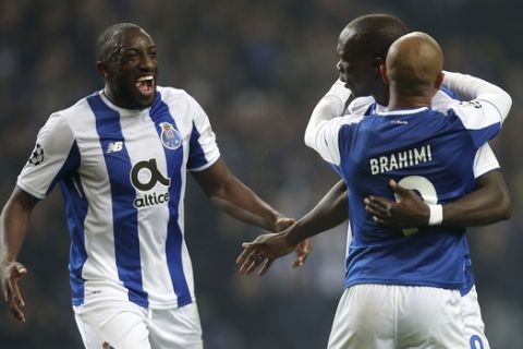 Porto's Yacine Brahimi, right, celebrates with Vincent Aboubakar, 2nd right, and Moussa Marega after scoring his side's third goal during the Champions League group G soccer match between FC Porto and AS Monaco at the Dragao stadium in Porto, Portugal, Wednesday, Dec. 6, 2017. (AP Photo/Luis Vieira)