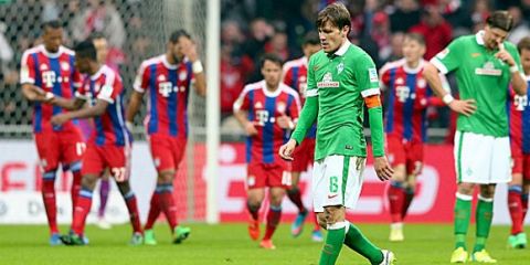BREMEN, GERMANY - MARCH 14:  Clemens Fritz (C) of Bremen and his team mate Sebastian Proedl (R)  reacts during the Bundesliga match between SV Werder Bremen and FC Bayern Muenchen at Weserstadion on March 14, 2015 in Bremen, Germany.  (Photo by Martin Rose/Bongarts/Getty Images)