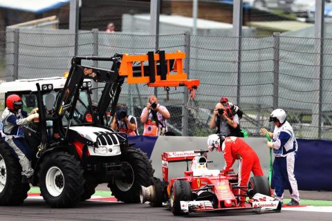 SPIELBERG, AUSTRIA - JULY 03: Sebastian Vettel of Germany driving the (5) Scuderia Ferrari SF16-H Ferrari 059/5 turbo (Shell GP) is removed from the track after crashing during the Formula One Grand Prix of Austria at Red Bull Ring on July 3, 2016 in Spielberg, Austria.  (Photo by Mark Thompson/Getty Images)