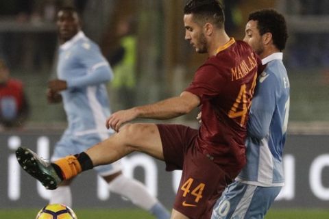 Roma's Kostas Manolas, left, is challenged by Lazio's Felipe Anderson during an Italian Cup, first-leg, semifinal soccer match, at the Rome Olympic stadium, Wednesday, March 1, 2017. (AP Photo/Gregorio Borgia)