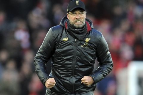 Liverpool manager Juergen Klopp greets supporters at the end of the English Premier League soccer match between Liverpool and AFC Bournemouth at Anfield stadium in Liverpool, England, Saturday, Feb. 9, 2019. (AP Photo/Rui Vieira)