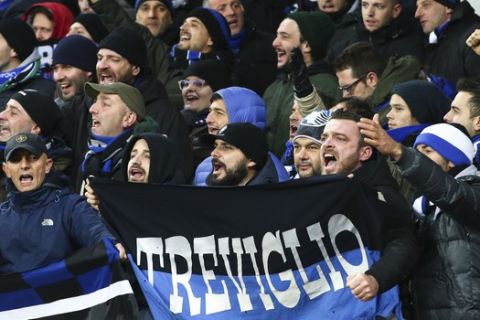 Atalanta's fans cheer at their team during the Europa League group E soccer match between Everton and Atalanta at the Goodison Park stadium in Liverpool, England on Thursday, Nov. 23, 2017. (AP Photo/Dave Thompson)