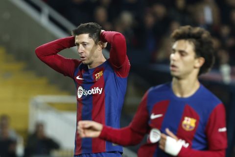 Barcelona's Robert Lewandowski reacts after missing a scoring chance during the Spanish La Liga soccer match between Barcelona and Almeria at the Olimpic Lluis Companys stadium in Barcelona, Spain, Wednesday, Dec. 20, 2023. (AP Photo/Joan Monfort)