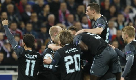 ajax players celebrate scoring their side's first goal during the second leg semi final soccer match between Olympique Lyon and Ajax in the Stade de Lyon, Decines, France, Thursday, May 11, 2017. (AP Photo/Laurent Cipriani)