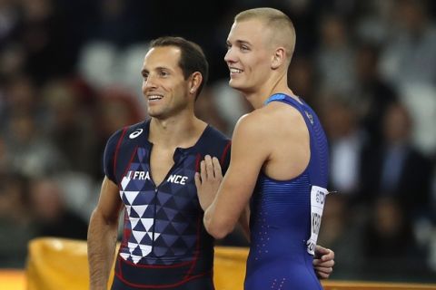 United States' gold medal winner Sam Kendricks, right, and France's bronze medal winner Renaud Lavillenie during the men's pole vault final during the World Athletics Championships in London Tuesday, Aug. 8, 2017. (AP Photo/Frank Augstein)