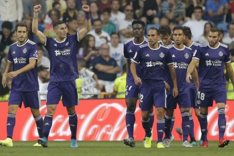 Valladolid's Sergi Guardiola, second left, celebrates after scoring his side's first goal during the Spanish La Liga soccer match between Real Madrid and Valladolid at the Santiago Bernabeu stadium in Madrid, Spain, Saturday, Aug. 24, 2019. (AP Photo/Paul White)
