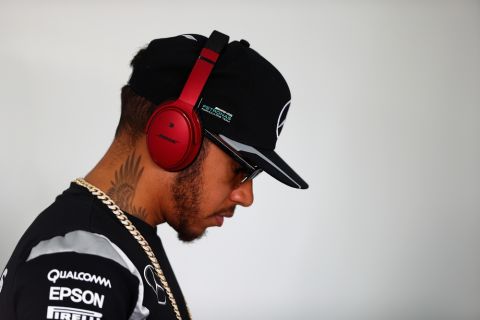 SAKHIR, BAHRAIN - APRIL 03: Lewis Hamilton of Great Britain and Mercedes GP listens to music before the drivers parade ahead of the Bahrain Formula One Grand Prix at Bahrain International Circuit on April 3, 2016 in Sakhir, Bahrain.  (Photo by Clive Mason/Getty Images)