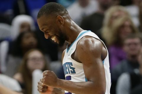 Charlotte Hornets guard Kemba Walker (15) celebrates after scoring against the Detroit Pistons during the first half of an NBA basketball game Sunday, April 7, 2019, in Detroit. (AP Photo/Duane Burleson)