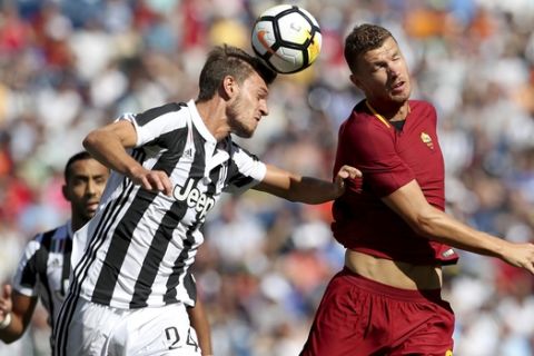 IMAGE DISTRIBUTED FOR INTERNATIONAL CHAMPIONS CUP - Juventus' Daniele Rugani (24) and AS Roma's Edin Dzeko (9) vie for a header during the first half of a International Champions Cup match Sunday, July 30, 2017, in Foxborough, Mass. (Damian Strohmeyer/AP Images for International Champions Cup)