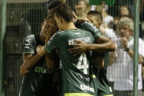 Luiz Otavio of Brazil's Chapecoense, center, celebrates with teammates after scoring against Colombia's Atletico Nacional, during a Recopa Sudamericana first leg final soccer match in Chapeco, Brazil, Tuesday, April 4, 2017. (AP Photo/Andre Penner)