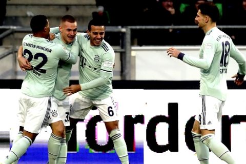 Bayern's Joshua Kimmich, 2nd left, celebrates after scoring the opening goal during the German Bundesliga soccer match between Hannover 96 and FC Bayern Munich in Hannover, Germany, Saturday, Dec. 15, 2018. (AP Photo/Michael Sohn)