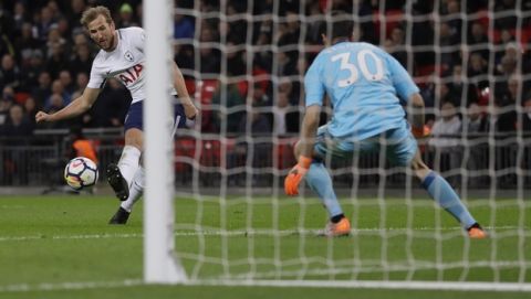 Tottenham's Harry Kane scores a disallowed goal during the English Premier League soccer match between Tottenham Hotspur and Watford at Wembley stadium in London, Monday, April 30, 2018. (AP Photo/Kirsty Wigglesworth)