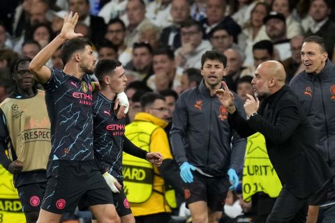 Οι παίκτες της Μάντσεστερ Σίτι πανηγυρίζουν γκολ που σημείωσαν κόντρα στη Ρεάλ για τα προημιτελικά του Champions League 2023-2024 στο "Σαντιάγο Μπερναμπέου", Μαδρίτη | Τρίτη 9 Απριλίου 2024