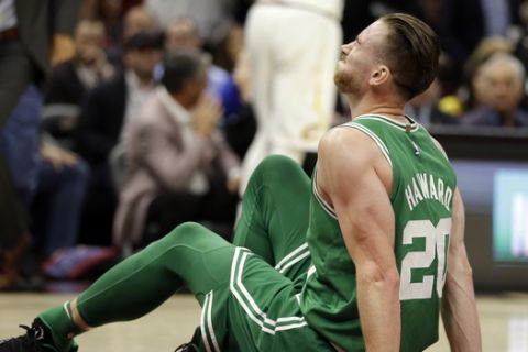 Boston Celtics' Gordon Hayward grimaces in pain in the first half of an NBA basketball game against the Cleveland Cavaliers, Tuesday, Oct. 17, 2017, in Cleveland. Just five minutes into his Boston career, new Celtics star forward Gordon Hayward gruesomely broke his left ankle, an injury that may end his season.(AP Photo/Tony Dejak)