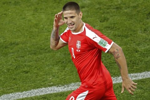 Serbia's Aleksandar Mitrovic celebrates after scoring the opening goal during the group E match between Switzerland and Serbia at the 2018 soccer World Cup in the Kaliningrad Stadium in Kaliningrad, Russia, Friday, June 22, 2018. (AP Photo/Antonio Calanni)