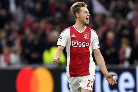 Ajax's Frenkie de Jong celebrates after Ajax's Matthijs de Ligt scoring his side's opening goal during the Champions League semifinal second leg soccer match between Ajax and Tottenham Hotspur at the Johan Cruyff ArenA in Amsterdam, Netherlands, Wednesday, May 8, 2019. (AP Photo/Martin Meissner)
