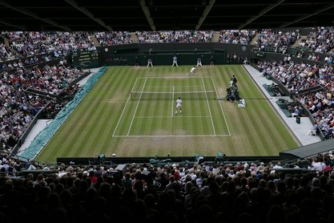 A view of No. 1 Court as Roger Federer of Switzerland plays Gilles Simon of France during the men's quarterfinal singles match at the All England Lawn Tennis Championships in Wimbledon, London, Wednesday July 8, 2015. (AP Photo/Tim Ireland)