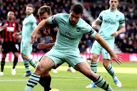 Arsenal's Sokratis Papastathopoulos shields the ball during their match against Bournemouth, during the English Premier League soccer match at The Vitality Stadium in Bournemouth, England, Sunday Nov. 25, 2018. (John Walton/PA via AP)