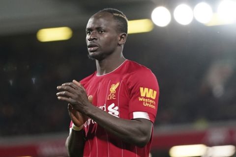Liverpool's Sadio Mane reacts as he substituted during the English Premier League soccer match between Liverpool and West Ham at Anfield Stadium in Liverpool, England, Monday, Feb. 24, 2020. (AP Photo/Jon Super)