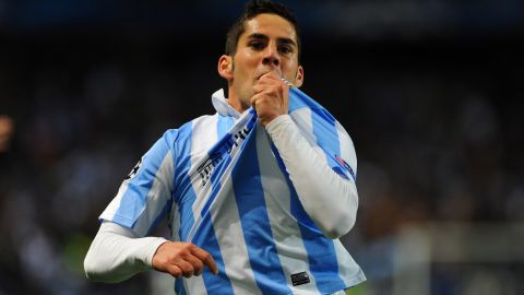Malaga's midfielder Isco celebrates after scoring the opening goal  during the UEFA Champions League round of 16 second leg football match Malaga CF vs FC Porto at La Rosaleda stadium in Malaga on March 13, 2013.   AFP PHOTO/ JORGE GUERRERO        (Photo credit should read Jorge Guerrero/AFP/Getty Images)