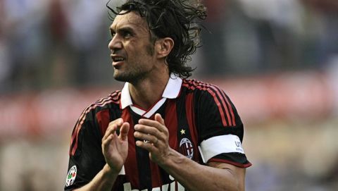 AC Milan defender Paolo Maldini salutes his fans at the end of the Italian Serie A soccer match between AC Milan and AS Roma at the San Siro stadium in Milan, Italy, Sunday, May 24, 2009. AC Milan captain 40 year-old Paolo Maldini played his last match at the San Siro stadium Sunday after 24 years and 901 games for the club.The match against AS Roma comes a week before the last game of the season away to Fiorentina and will bring to an end a career in which he has won seven Italian league titles, five Champions Leagues and 126 caps for Italy. (AP Photo/Alberto Pellaschiar)