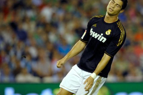 Real Madrid's Portuguese forward Cristiano Ronaldo reacts during the Spanish league football match Racing vs Real Madrid on September 21, 2011, at El Sardinero Stadium in Santander. AFP PHOTO/ MIGUEL RIOPA (Photo credit should read MIGUEL RIOPA/AFP/Getty Images)