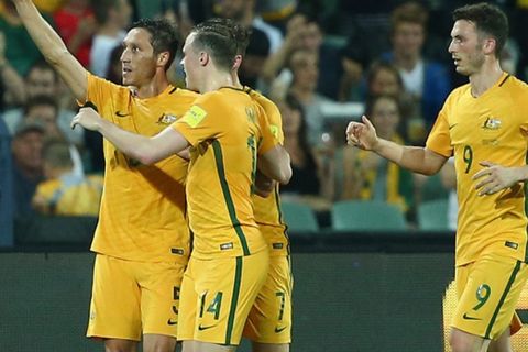 ADELAIDE, AUSTRALIA - MARCH 24:  Mark Milligan of Australia celebrates with team mates after scoring a penalty during the 2018 FIFA World Cup Qualification match between the Australia Socceroos and Tajikistan at the Adelaide Oval on March 24, 2016 in Adelaide, Australia.  (Photo by Robert Cianflone/Getty Images)