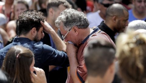 Horacio Sala, center, father of Argentine soccer player Emiliano Sala, cries after his son's wake in Progreso, Argentina, Saturday, Feb. 16, 2019. The Argentina-born forward died in an airplane crash in the English Channel last month when flying from Nantes in France to start his new career with English Premier League club Cardiff. (AP Photo/Natacha Pisarenko)