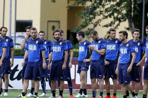 Players of the Italian national team warm up during a training session ahead of Friday's Euro 2016 soccer match against Croatia, at the Coverciano training center, near Florence, Italy, Wednesday, June 10, 2015. (AP Photo/Fabrizio Giovannozzi)