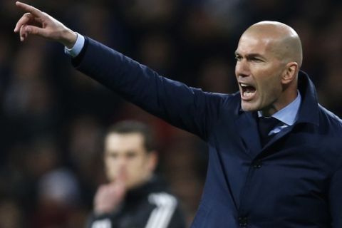 Real Madrid coach Zinedine Zidane reacts during a Champions League quarter final second leg soccer match between Real Madrid and Juventus at the Santiago Bernabeu stadium in Madrid, Wednesday, April 11, 2018. (AP Photo/Francisco Seco)