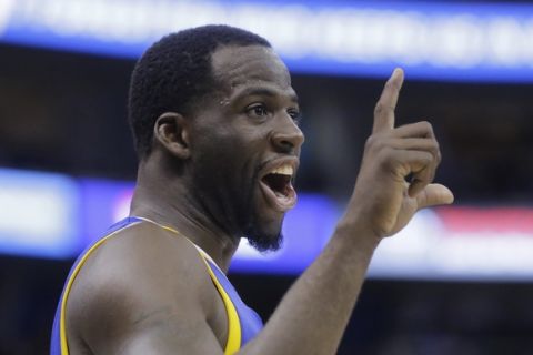 Golden State Warriors forward Draymond Green reacts to the Utah Jazz fans in the second half during Game 3 of the NBA basketball second-round playoff series Saturday, May 6, 2017, in Salt Lake City. Warriors won 102 - 91. (AP Photo/Rick Bowmer)