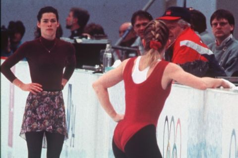American figure skater Nancy Kerrigan, left, looks in the direction of teammate Tonya Harding during their practice session before the women's technical program got underway later in the day in Hamar, Norway on Feb. 23, 1994. (AP Photo/John Gaps III)