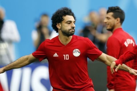 Egypt's Mohamed Salah practices during Egypt's official training on the eve of the group A match between Russia and Egypt at the 2018 soccer World Cup in the St. Petersburg stadium in St. Petersburg, Russia, Monday, June 18, 2018. (AP Photo/Efrem Lukatsky)