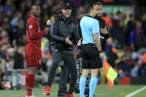 Liverpool manager Jurgen Klopp gestures on the touchline during the Champions League Semi Final, second leg soccer match between Liverpool and Barcelona at Anfield, Liverpool, England, Tuesday, May 7, 2019. Liverpool won the match 4-0 to overturn a three-goal deficit to win the match 4-3 on aggregate. (Peter Byrne/PA via AP)