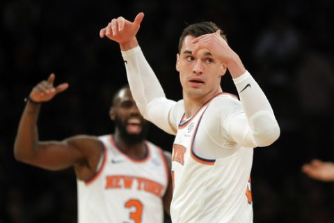 New York Knicks forward Mario Hezonja (8) reacts after hitting a 3-point shot against the Milwaukee Bucks during the first quarter of an NBA basketball game, Saturday, Dec. 1, 2018, in New York. The Knicks won 136-134 in overtime. (AP Photo/Julie Jacobson)
